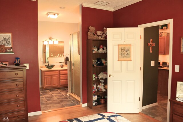 650 S Eagles Way, Crawfordsville, IN 47933 - bedroom featuring ornamental molding, dark wood-style floors, and ensuite bathroom