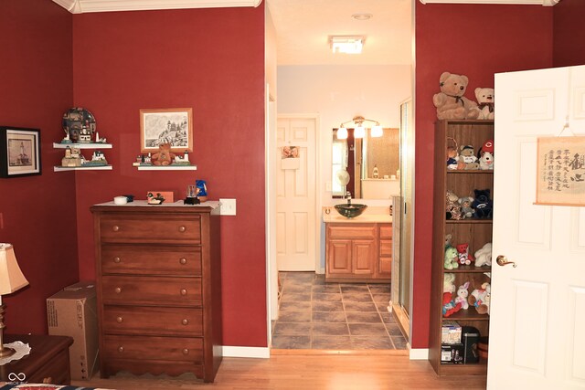 650 S Eagles Way, Crawfordsville, IN 47933 - bedroom featuring ensuite bath and wood finished floors