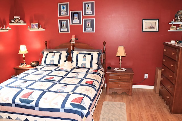 650 S Eagles Way, Crawfordsville, IN 47933 - bedroom featuring wood finished floors and baseboards