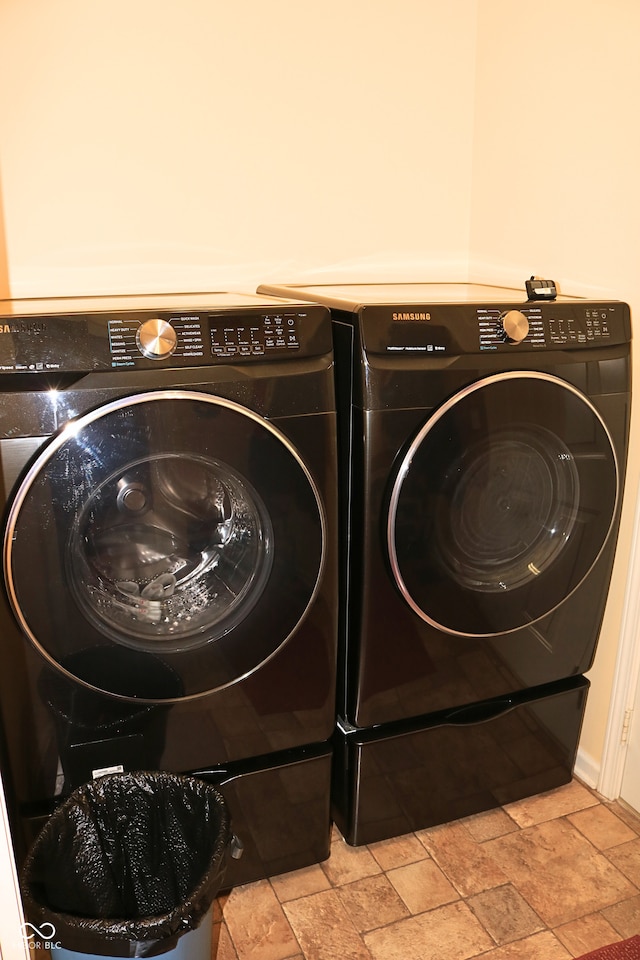 650 S Eagles Way, Crawfordsville, IN 47933 - washroom featuring separate washer and dryer and stone tile flooring