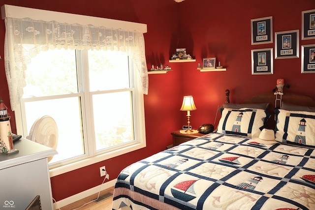 650 S Eagles Way, Crawfordsville, IN 47933 - bedroom featuring multiple windows and wood finished floors