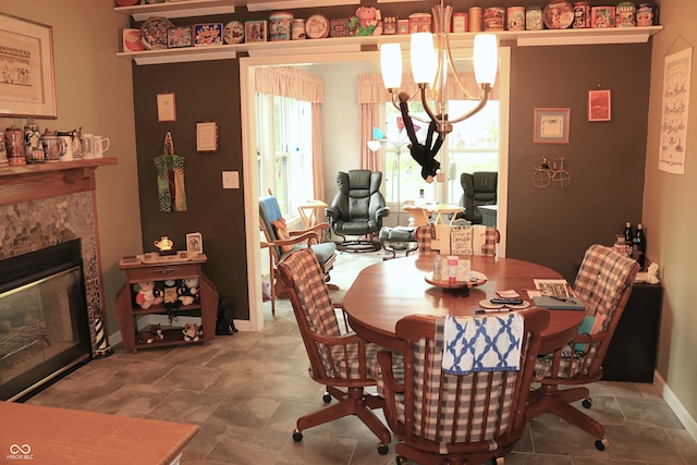 650 S Eagles Way, Crawfordsville, IN 47933 - dining area featuring a chandelier, a high end fireplace, and stone finish floors