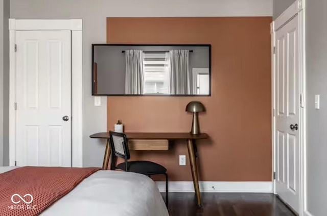 213 E 15th St, Indianapolis, IN 46202 - bedroom with baseboards and dark wood-style flooring