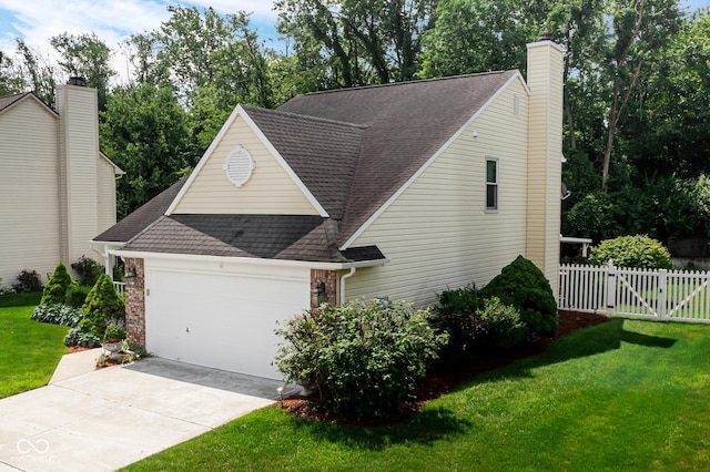 6439 Bower Dr, Indianapolis, IN 46241 - view of front of home with a shingled roof, an attached garage, driveway, and a chimney