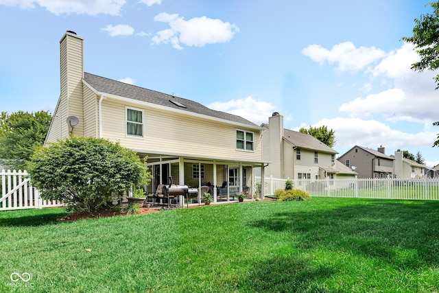6439 Bower Dr, Indianapolis, IN 46241 - back of house featuring a patio area, a chimney, and a fenced backyard