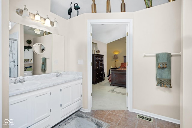 6439 Bower Dr, Indianapolis, IN 46241 - ensuite bathroom with double vanity and tile patterned flooring