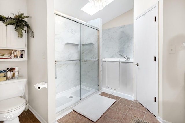 6439 Bower Dr, Indianapolis, IN 46241 - bathroom with a garden tub, tile patterned flooring, a stall shower, and lofted ceiling