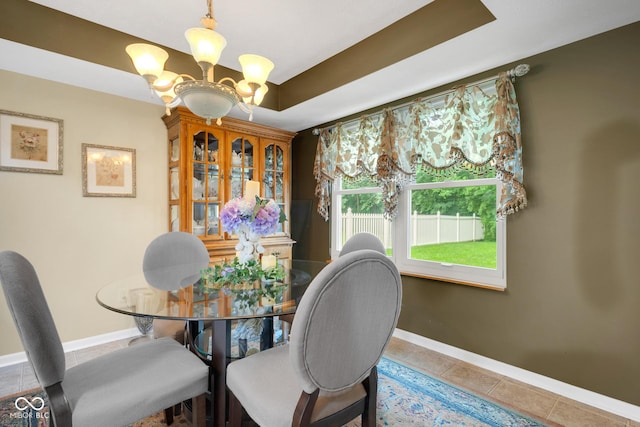 6439 Bower Dr, Indianapolis, IN 46241 - tiled dining area featuring a chandelier and a raised ceiling