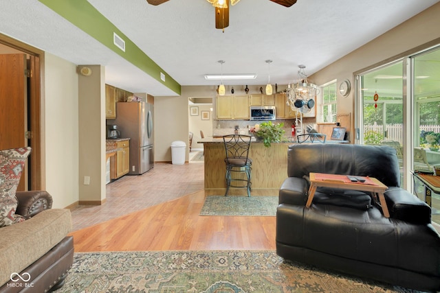 6439 Bower Dr, Indianapolis, IN 46241 - living room with ceiling fan and light wood-style floors