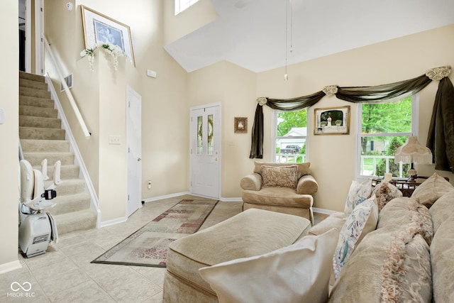 6439 Bower Dr, Indianapolis, IN 46241 - tiled living room featuring stairway and a towering ceiling