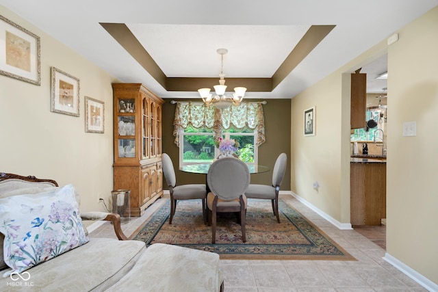 6439 Bower Dr, Indianapolis, IN 46241 - dining area with a chandelier, a raised ceiling, and light tile patterned flooring