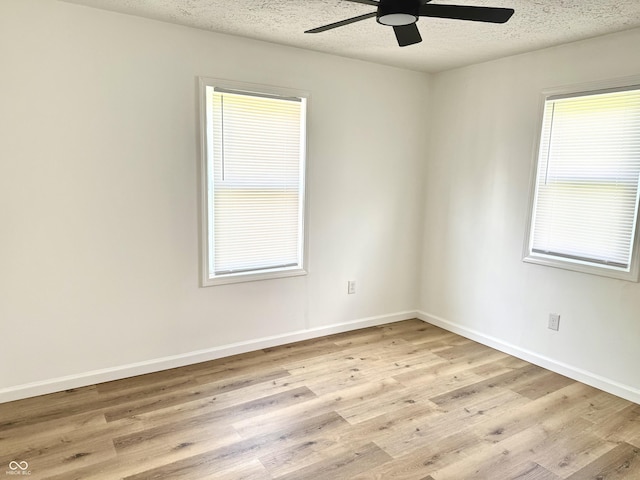 405 E Cowing Dr, Muncie, IN 47303 - spare room featuring ceiling fan, light wood-style floors, and a textured ceiling