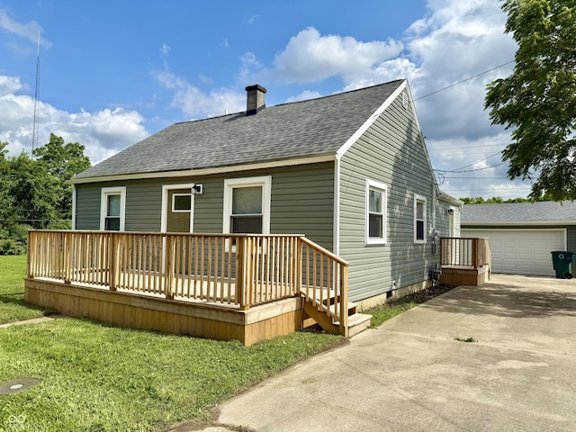 405 E Cowing Dr, Muncie, IN 47303 - back of house with a chimney, roof with shingles, a wooden deck, crawl space, and a detached garage