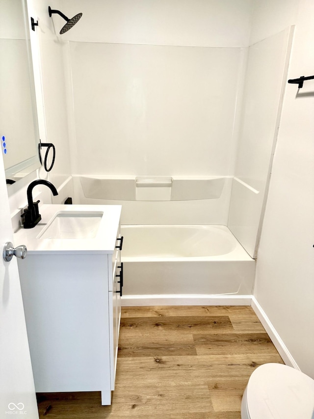 405 E Cowing Dr, Muncie, IN 47303 - bathroom with vanity, wood finished floors, and  shower combination