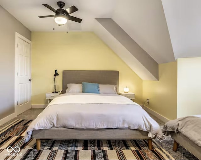 215 E 15th St, Indianapolis, IN 46202 - bedroom with carpet floors, vaulted ceiling, and a ceiling fan