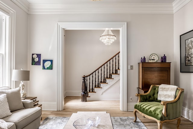 214 E St Joseph St, Indianapolis, IN 46202 - living area with ornamental molding, a chandelier, wood finished floors, and stairs