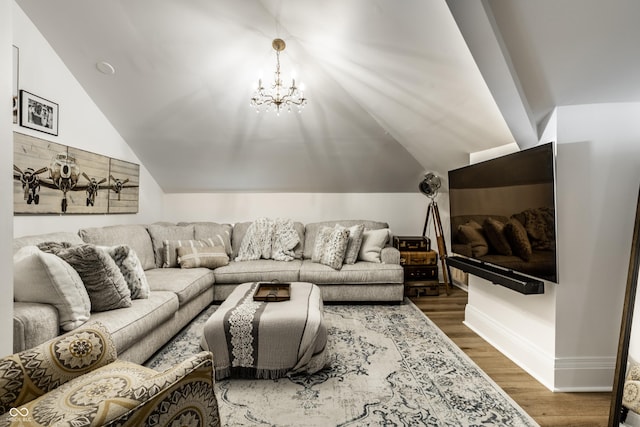 214 E St Joseph St, Indianapolis, IN 46202 - living room with vaulted ceiling, wood finished floors, and a chandelier