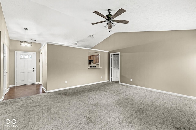 1540 Brook Pointe Dr, Indianapolis, IN 46234 - unfurnished room featuring dark carpet, ceiling fan, lofted ceiling, and a chandelier