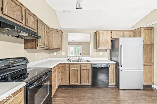 1540 Brook Pointe Dr, Indianapolis, IN 46234 - kitchen featuring black appliances, under cabinet range hood, vaulted ceiling, light countertops, and dark wood-style flooring