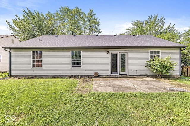 1540 Brook Pointe Dr, Indianapolis, IN 46234 - rear view of house with a patio area, a lawn, and roof with shingles