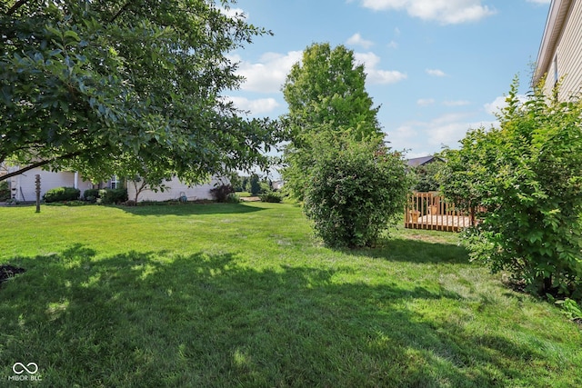 6711 Crestwell Ln, Indianapolis, IN 46268 - view of grassy yard with a deck