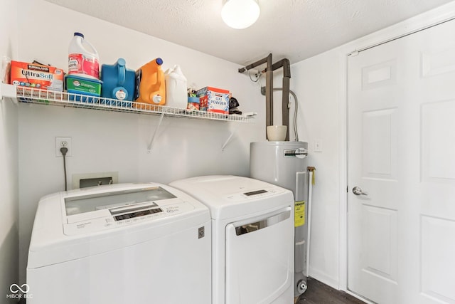 6711 Crestwell Ln, Indianapolis, IN 46268 - laundry area with washer and clothes dryer, water heater, dark wood-style flooring, and a textured ceiling