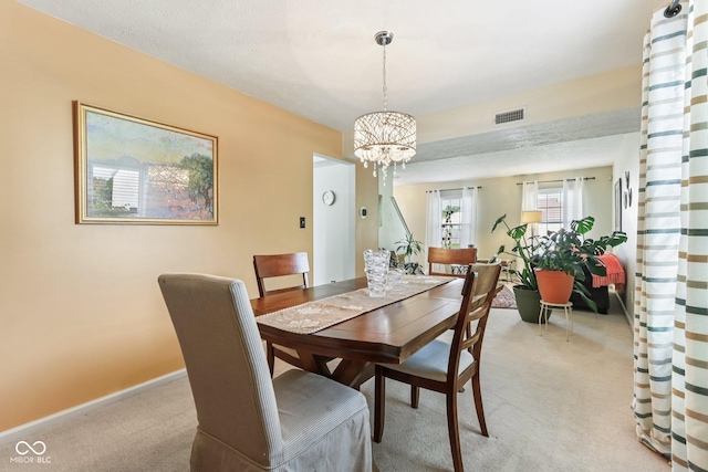 6711 Crestwell Ln, Indianapolis, IN 46268 - dining room featuring light carpet and a chandelier