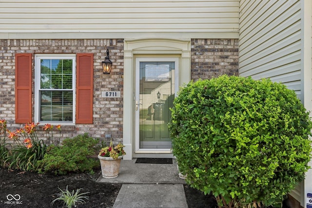 6711 Crestwell Ln, Indianapolis, IN 46268 - property entrance with brick siding