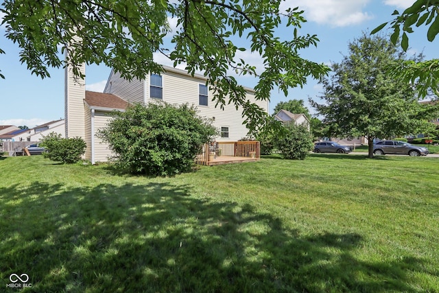 6711 Crestwell Ln, Indianapolis, IN 46268 - view of green lawn featuring a wooden deck
