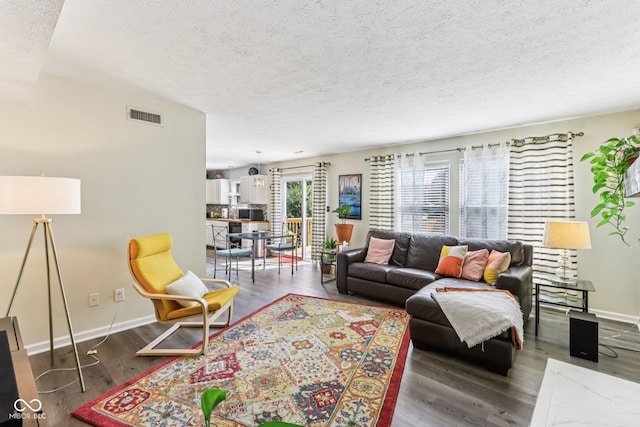 6711 Crestwell Ln, Indianapolis, IN 46268 - living area with a textured ceiling and wood finished floors