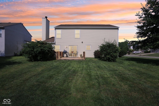 6711 Crestwell Ln, Indianapolis, IN 46268 - rear view of house featuring a chimney, a yard, and a patio area