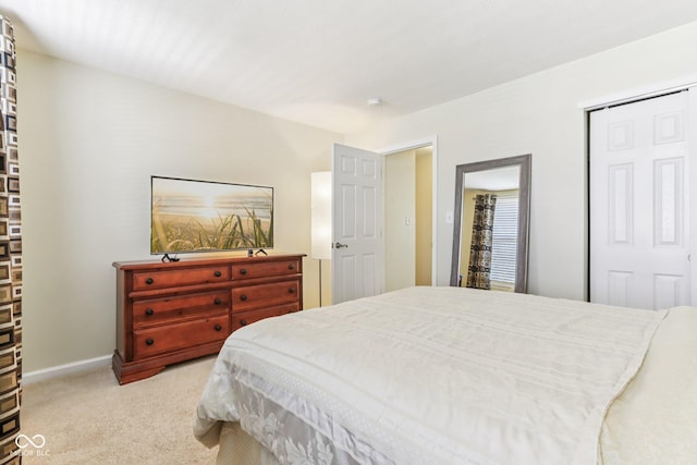 6711 Crestwell Ln, Indianapolis, IN 46268 - bedroom featuring a closet and light carpet