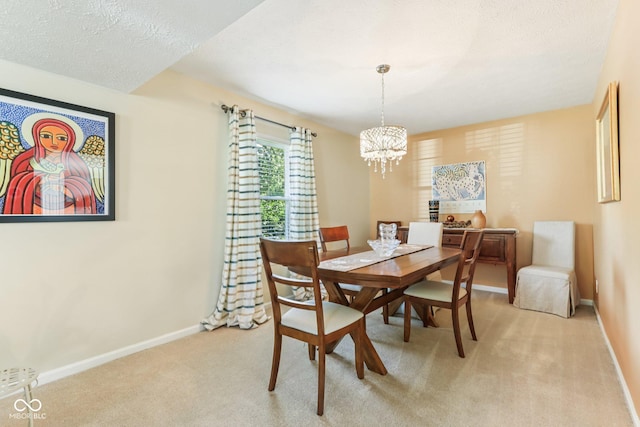 6711 Crestwell Ln, Indianapolis, IN 46268 - dining space with a chandelier, light carpet, and a textured ceiling