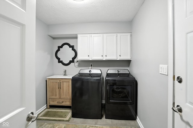 8030 5 Points Rd, Indianapolis, IN 46259 - laundry area featuring cabinet space, washing machine and dryer, and a textured ceiling