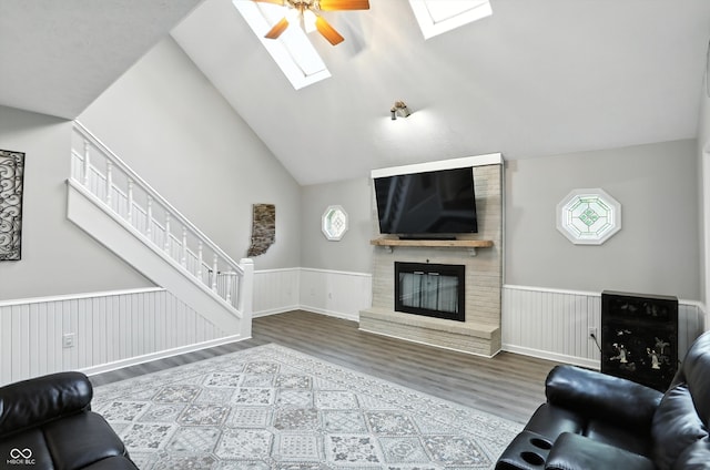 8030 5 Points Rd, Indianapolis, IN 46259 - living area with wood finished floors, a skylight, wainscoting, a ceiling fan, and healthy amount of natural light