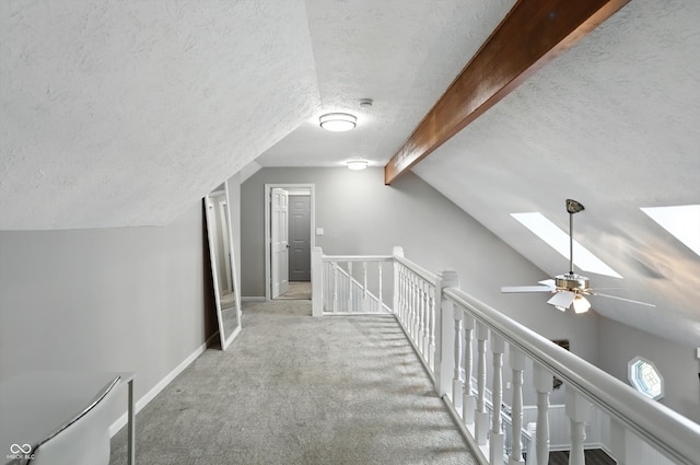 8030 5 Points Rd, Indianapolis, IN 46259 - hallway with an upstairs landing, a textured ceiling, a skylight, and carpet flooring