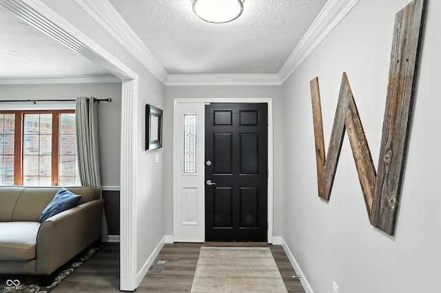 8030 5 Points Rd, Indianapolis, IN 46259 - entrance foyer with dark wood-style floors, a textured ceiling, and ornamental molding