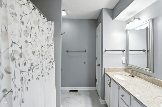8030 5 Points Rd, Indianapolis, IN 46259 - bathroom featuring marble finish flooring, vanity, curtained shower, and a textured ceiling