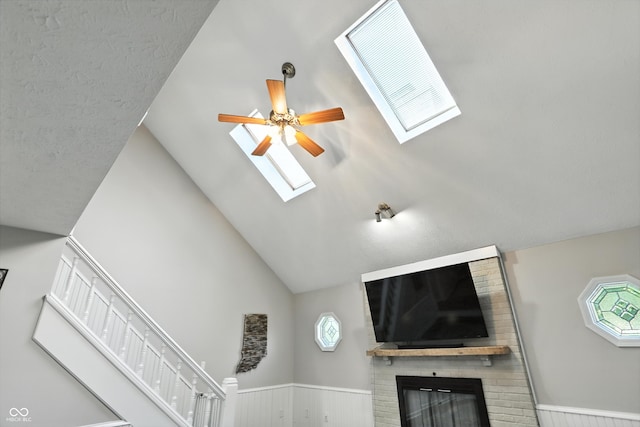 8030 5 Points Rd, Indianapolis, IN 46259 - detailed view of a skylight, a ceiling fan, a brick fireplace, and wainscoting