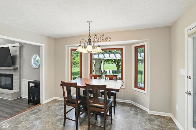 8030 5 Points Rd, Indianapolis, IN 46259 - dining space with plenty of natural light, stone finish flooring, a chandelier, and a textured ceiling
