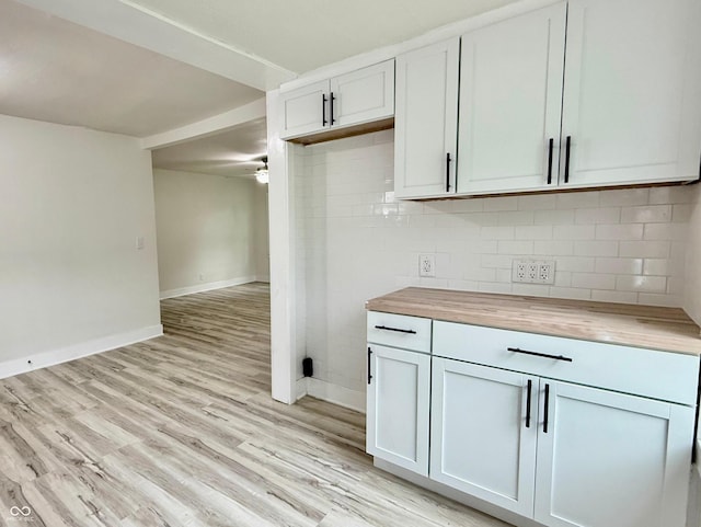 3712 S Kealing Ave S, Indianapolis, IN 46237 - kitchen featuring wooden counters, light wood-type flooring, tasteful backsplash, and a ceiling fan