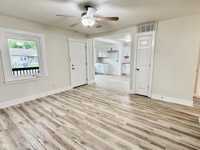 3712 S Kealing Ave S, Indianapolis, IN 46237 - unfurnished living room with ceiling fan and light wood-type flooring