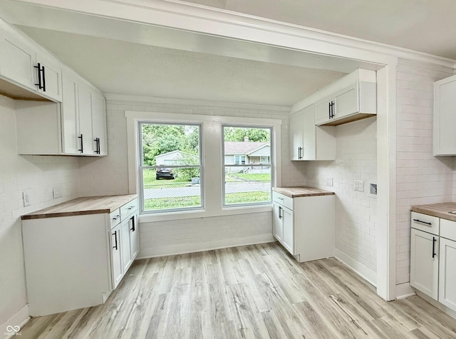 3712 S Kealing Ave S, Indianapolis, IN 46237 - kitchen featuring light wood-style floors, butcher block countertops, and white cabinetry