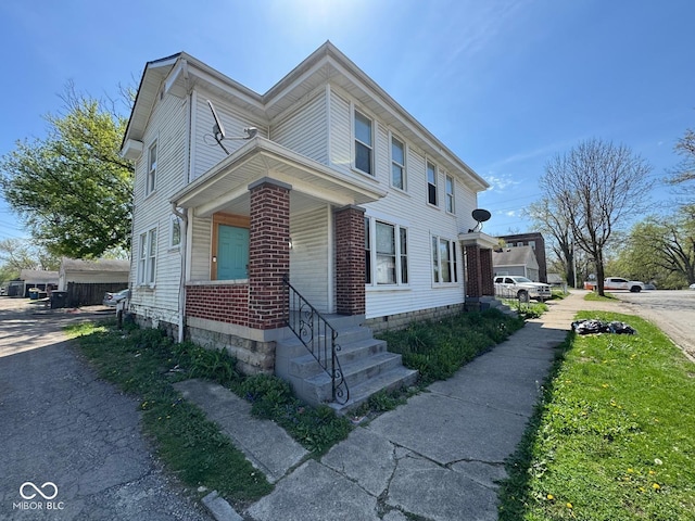 7 N Colorado Ave, Indianapolis, IN 46201 - view of side of property with brick siding and covered porch