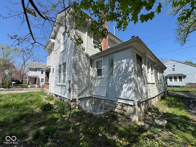 7 N Colorado Ave, Indianapolis, IN 46201 - view of side of home featuring a chimney