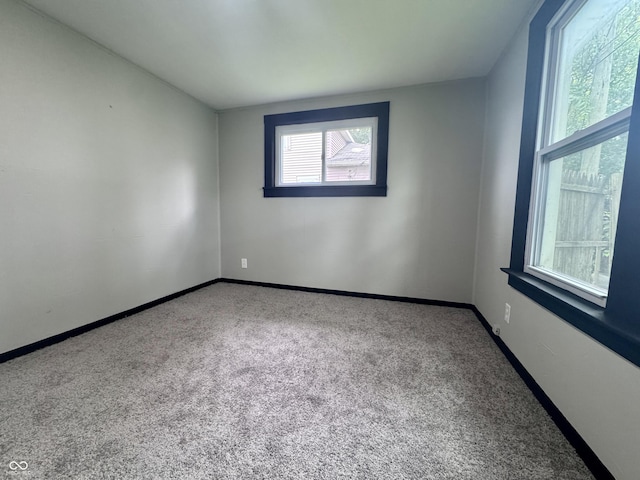 1013 E Pike St, Crawfordsville, IN 47933 - carpeted empty room with baseboards