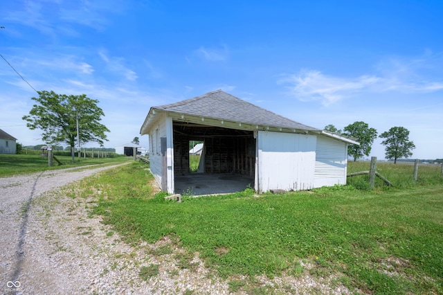 5396 N 1000 E, Sheridan, IN 46069 - view of side of property with a pole building, an outdoor structure, roof with shingles, driveway, and a lawn