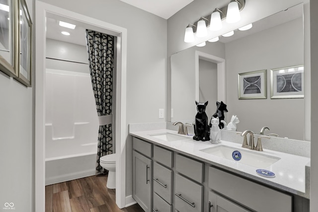 5343 Pelion Pl, Mccordsville, IN 46055 - bathroom featuring double vanity, wood finished floors, and shower / bathtub combination with curtain