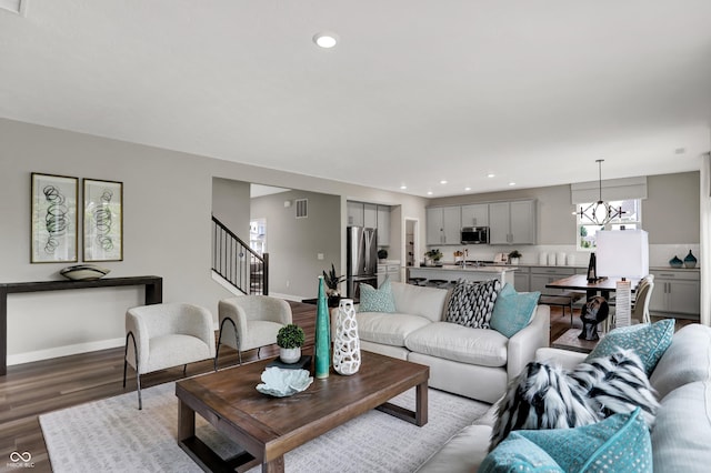 5343 Pelion Pl, Mccordsville, IN 46055 - living area with wood finished floors, stairs, a chandelier, and recessed lighting