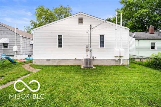 2410 S Ebright St, Muncie, IN 47302 - rear view of house featuring a lawn